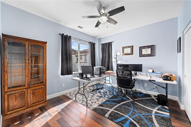 office space with visible vents, baseboards, wood finished floors, and a ceiling fan