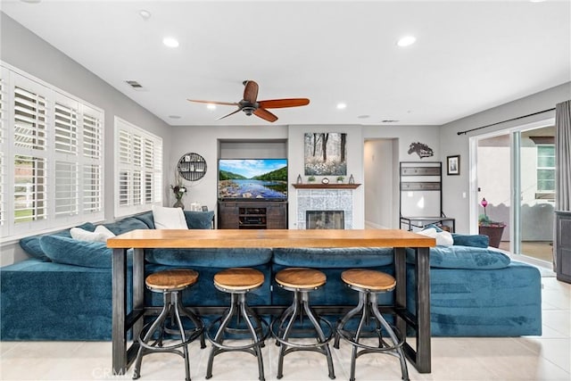 kitchen with recessed lighting, visible vents, a fireplace, and light tile patterned floors