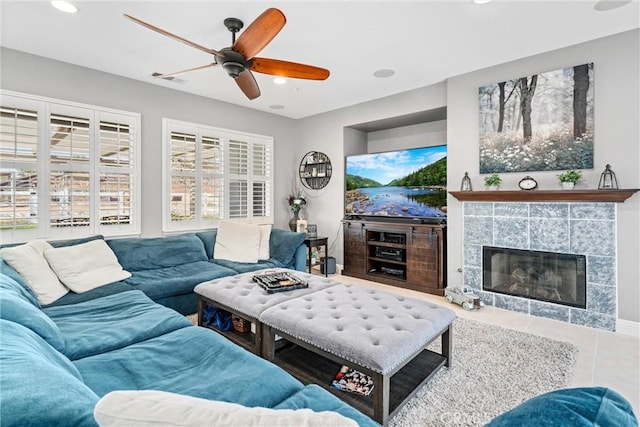 living room with tile patterned flooring, visible vents, recessed lighting, a fireplace, and a ceiling fan