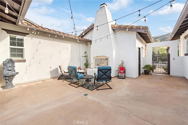 view of patio featuring a gate