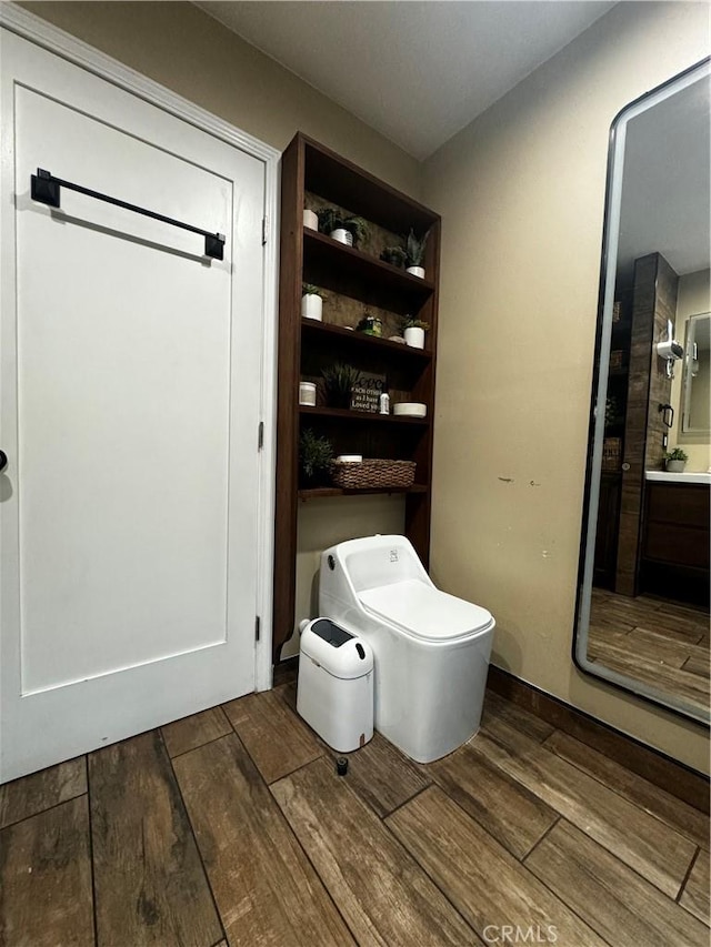 bathroom with vanity and wood finished floors