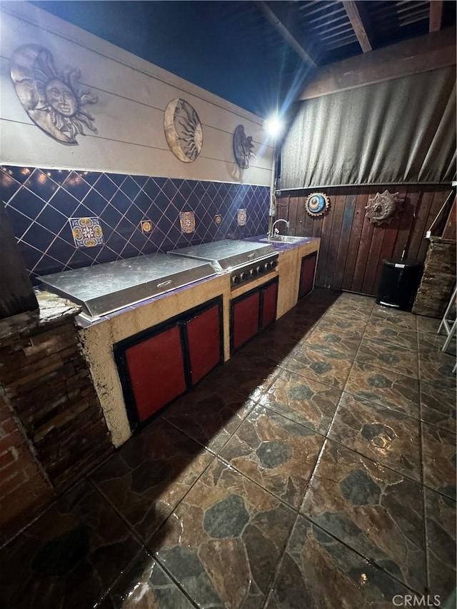 view of patio / terrace with an outdoor kitchen and a sink