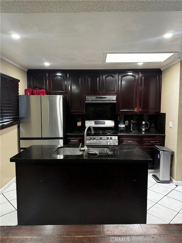 kitchen featuring decorative backsplash, under cabinet range hood, appliances with stainless steel finishes, and ornamental molding