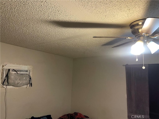 unfurnished bedroom with a textured ceiling and a ceiling fan