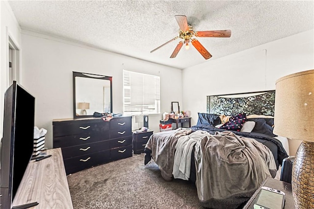 carpeted bedroom with a textured ceiling and a ceiling fan