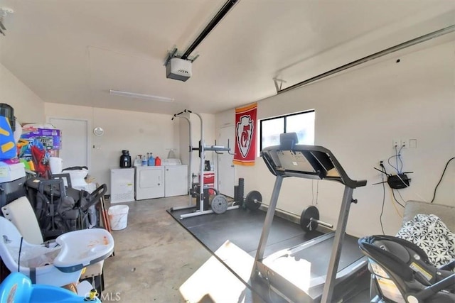 workout area featuring a garage and separate washer and dryer