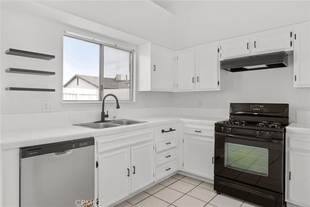 kitchen featuring gas stove, white cabinetry, a sink, under cabinet range hood, and stainless steel dishwasher