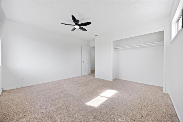 2100 Butterfield Ave, Bakersfield, CA 93304 - unfurnished bedroom with carpet floors, a closet, ceiling fan, baseboards, and a textured ceiling
