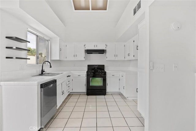 kitchen featuring visible vents, a sink, under cabinet range hood, black range with gas stovetop, and dishwasher