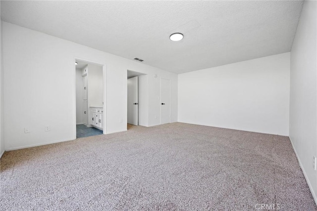 2100 Butterfield Ave, Bakersfield, CA 93304 - spare room featuring carpet flooring and a textured ceiling