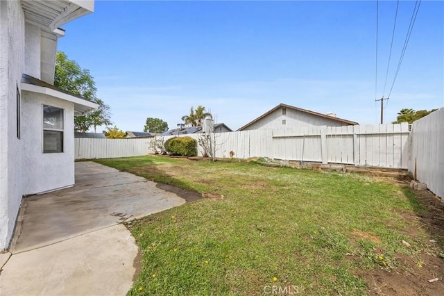 view of yard featuring a patio and a fenced backyard