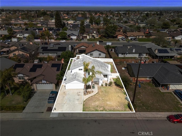 birds eye view of property with a residential view