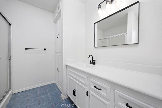 2100 Butterfield Ave, Bakersfield, CA 93304 - bathroom with vanity, tile patterned flooring, an enclosed shower, and baseboards
