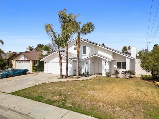 2100 Butterfield Ave, Bakersfield, CA 93304 - view of front of house with an attached garage, a front yard, driveway, and stucco siding