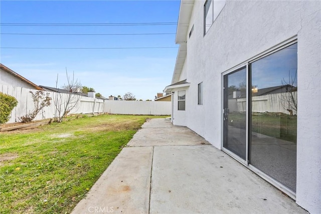 view of yard featuring a patio area and a fenced backyard