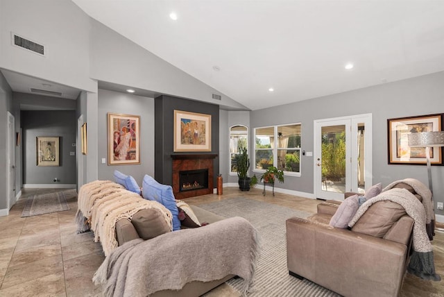 living area featuring visible vents, recessed lighting, and a warm lit fireplace