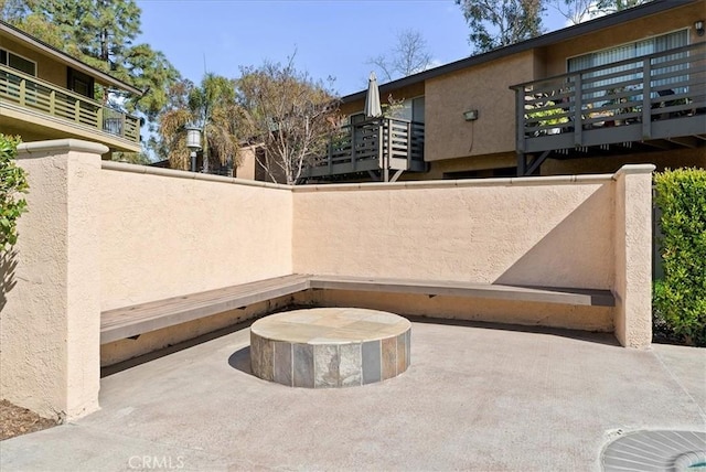 view of patio / terrace featuring fence