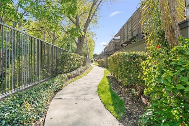 view of community with fence