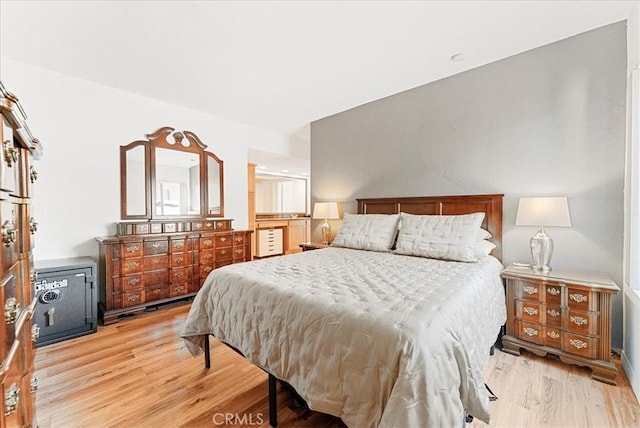 bedroom with wood finished floors