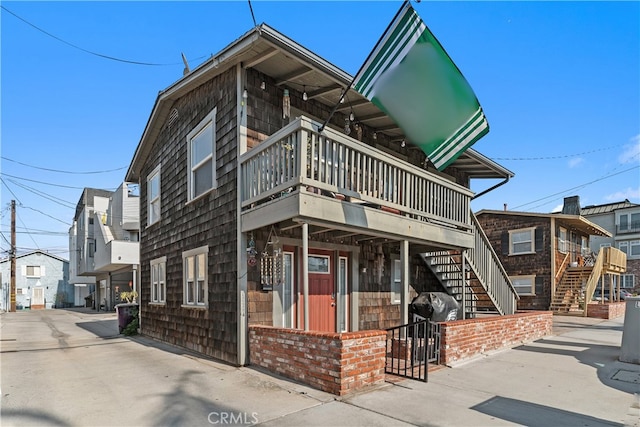 view of property featuring stairs