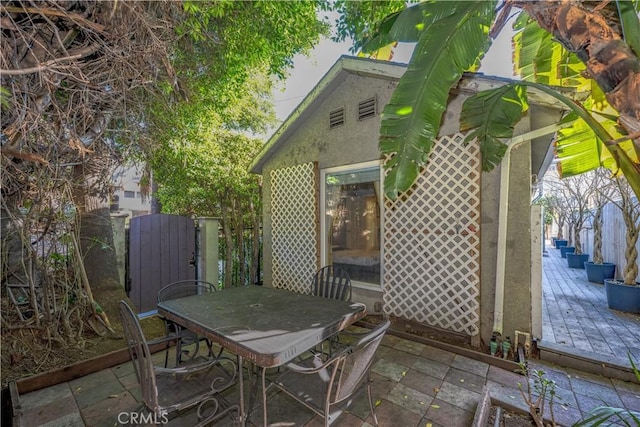 view of patio featuring outdoor dining space and a deck