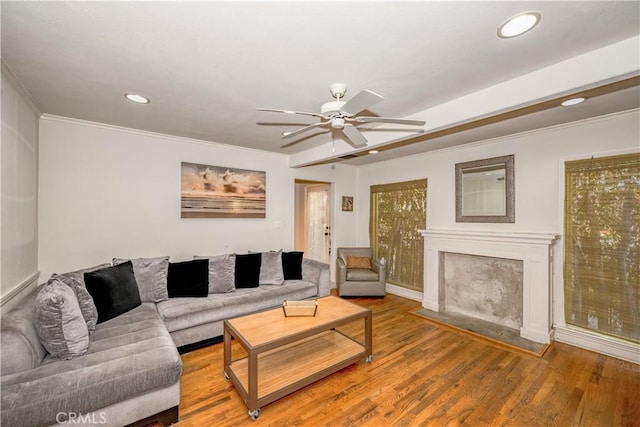 living area with recessed lighting, ornamental molding, ceiling fan, and wood finished floors