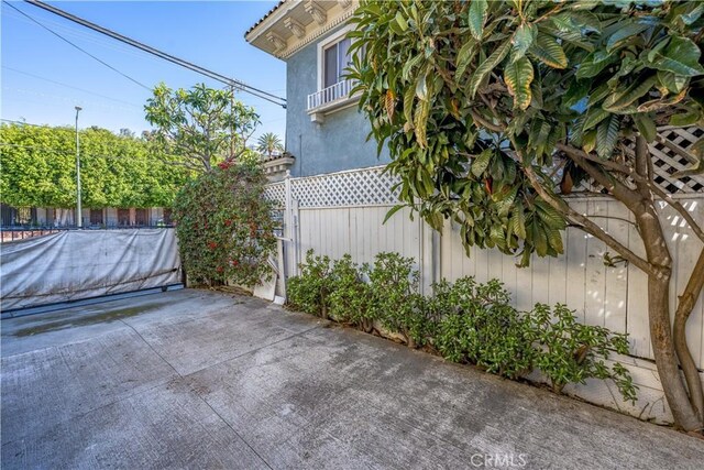 view of patio featuring fence