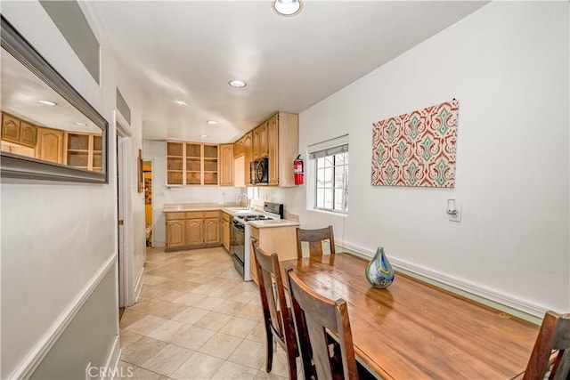 dining room featuring light tile patterned floors, recessed lighting, and baseboards