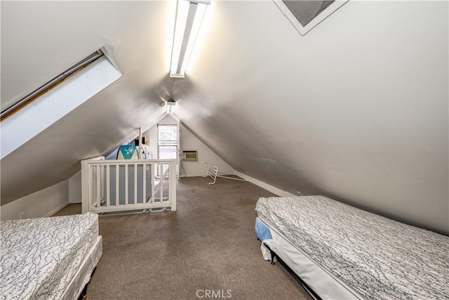 bedroom featuring vaulted ceiling, a wall mounted air conditioner, and carpet floors