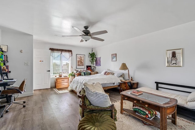 bedroom featuring a ceiling fan and wood finished floors