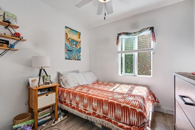 bedroom with wood finished floors and a ceiling fan