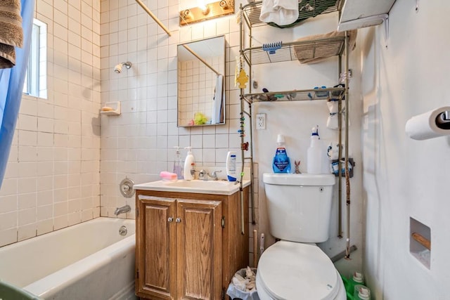 full bathroom with toilet, shower / bath combination, tile walls, decorative backsplash, and vanity