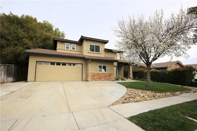 view of front facade featuring stucco siding, a front lawn, concrete driveway, and an attached garage