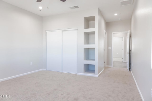 unfurnished bedroom featuring a closet, visible vents, and baseboards