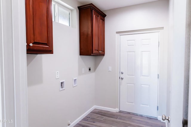 clothes washing area with washer hookup, wood finished floors, cabinet space, baseboards, and hookup for an electric dryer