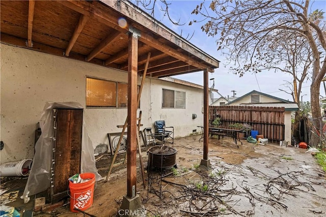 view of patio / terrace featuring fence