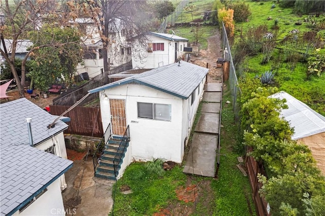 view of outbuilding with fence