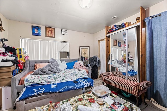 bedroom featuring a closet and tile patterned flooring