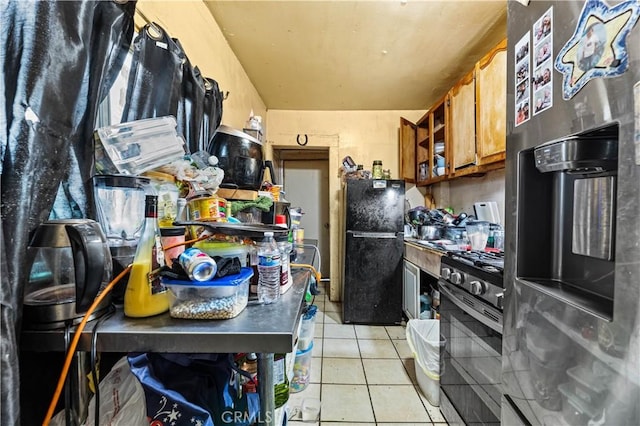 kitchen with open shelves, light tile patterned floors, brown cabinets, and appliances with stainless steel finishes