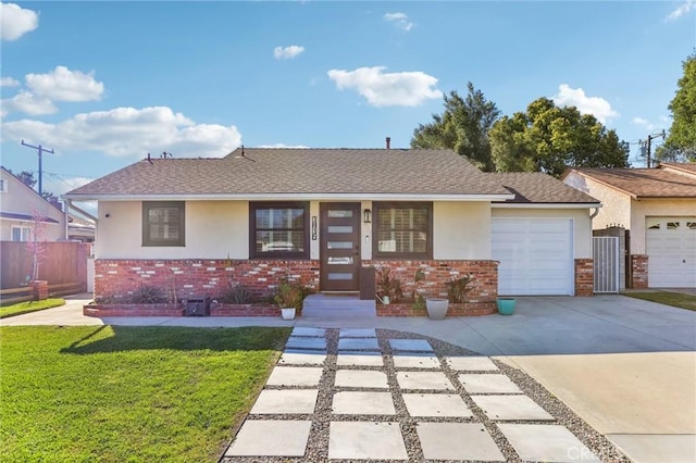 single story home featuring brick siding, stucco siding, and an attached garage