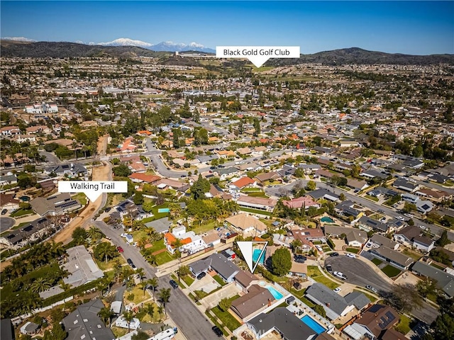 drone / aerial view with a mountain view and a residential view