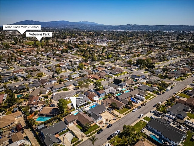 bird's eye view featuring a residential view and a mountain view