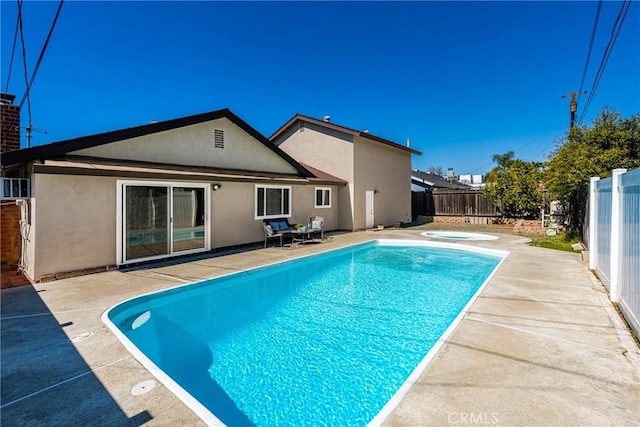 view of pool featuring a patio, a jacuzzi, a fenced backyard, and a fenced in pool