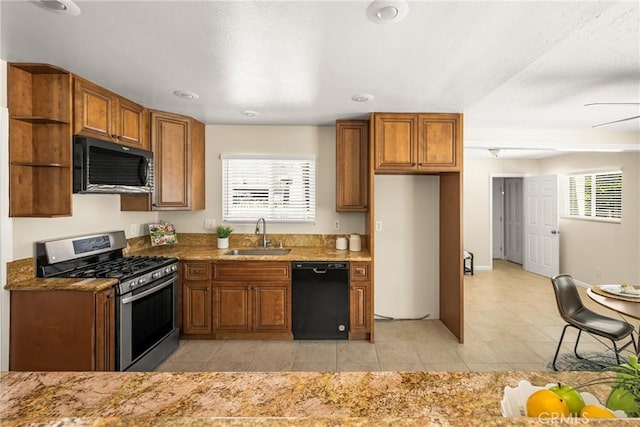 kitchen featuring a sink, open shelves, stainless steel range with gas cooktop, brown cabinetry, and dishwasher