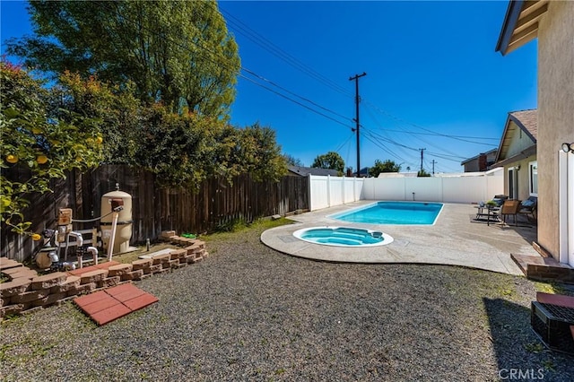 view of swimming pool with a fenced backyard, a fenced in pool, and a patio