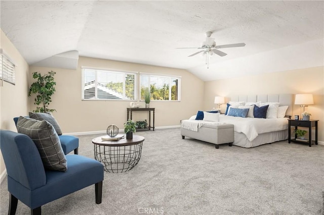 carpeted bedroom with baseboards, ceiling fan, a textured ceiling, and lofted ceiling