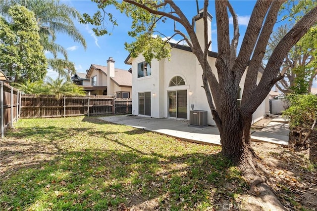 3266 Ashgate Ct, Ontario, CA 91761 - rear view of house with a fenced backyard, central AC, stucco siding, and a patio area