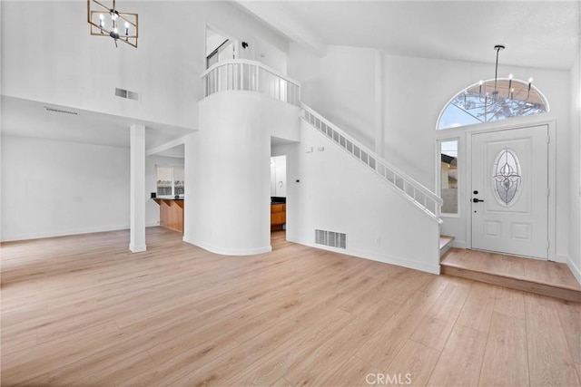 3266 Ashgate Ct, Ontario, CA 91761 - foyer with stairs, visible vents, a chandelier, and wood finished floors