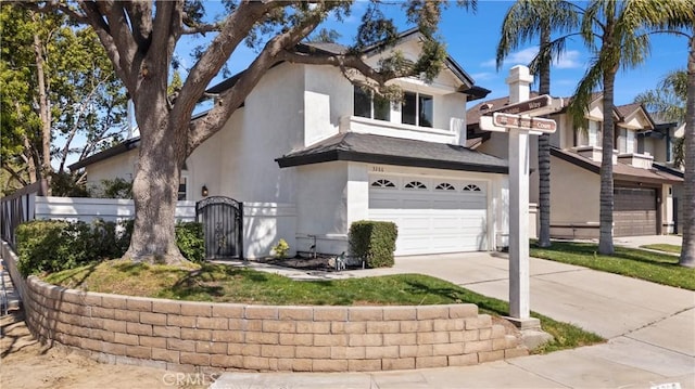 3266 Ashgate Ct, Ontario, CA 91761 - view of front of home with a garage, driveway, stucco siding, and fence