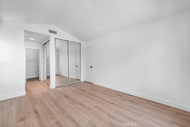 3266 Ashgate Ct, Ontario, CA 91761 - unfurnished bedroom with baseboards, visible vents, light wood-type flooring, and vaulted ceiling